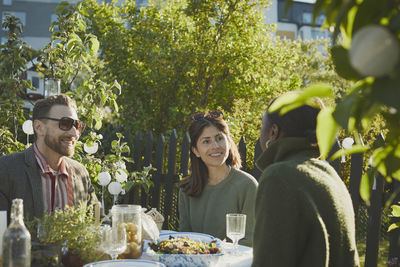 Friends having meal in garden