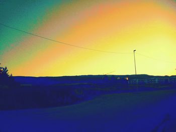 Silhouette landscape against sky during sunset