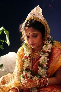 Close-up of bride in make-up looking away