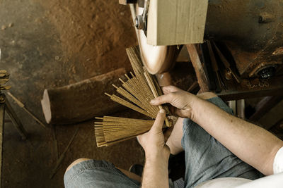 High angle view of man working on wood