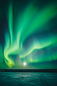 Scenic view of sea against sky at night