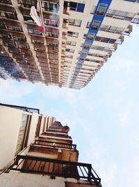 View of the blue sky between the two hotel buildings, taken from the bottom up with the right angle