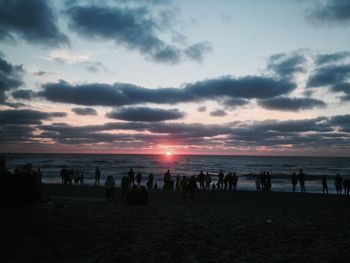 Scenic view of beach at sunset