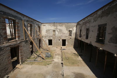 Abandoned building against sky