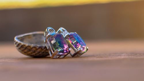 Close-up of wedding rings on table