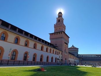 Low angle view of building against clear blue sky