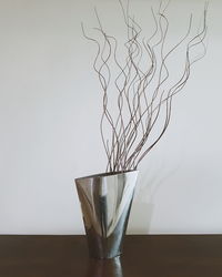 Close-up of drink on table against white background