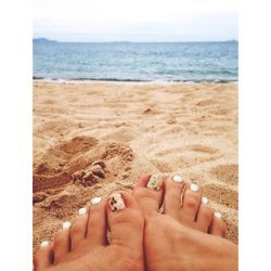 Low section of woman on beach