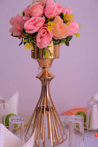 Close-up of pink flower vase on table