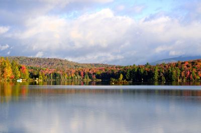 Scenic view of lake against sky during autumn