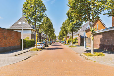 Street amidst buildings against sky