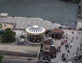 High angle view of people in city by sea
