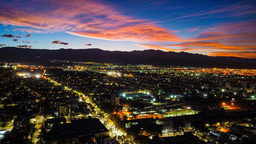 Sunset lights fading over mendoza city illuminated