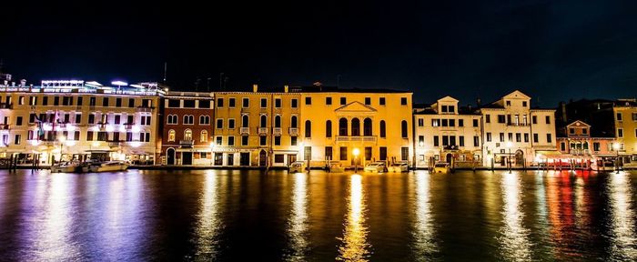 Reflection of illuminated buildings in water