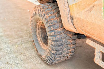 Red clay coated treads on dirt roads.