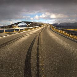 Surface level of highway against sky