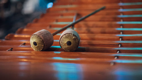 Close-up of mallets on wooden xylophone