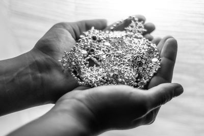 Cropped hand of person holding decorations