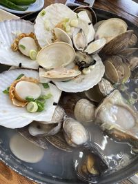 High angle view of shells in plate on table