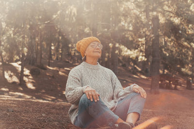 Rear view of woman standing in park