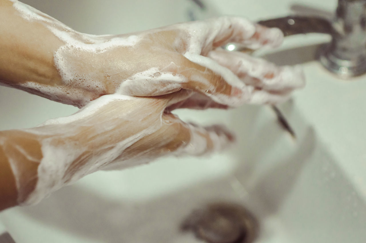 CLOSE-UP OF WOMAN HAND IN THE DARK