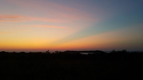 Scenic view of silhouette landscape against sky during sunset