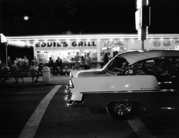 Cars on street in city at night