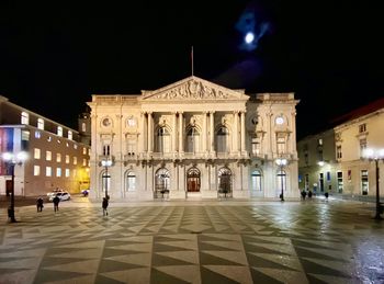 Buildings in city at night