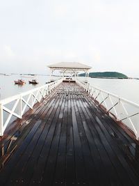 Boat sailing on sea against sky
