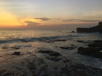 Scenic view of sea against dramatic sky