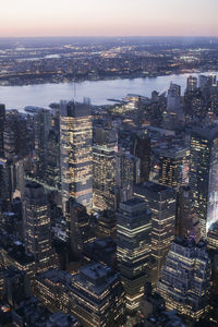 High angle view of illuminated buildings against sky in new york 