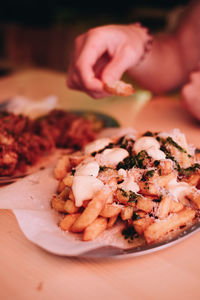 Close-up of hand on plate