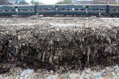 Heap of garbage by railroad tracks