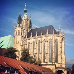 Low angle view of church against blue sky