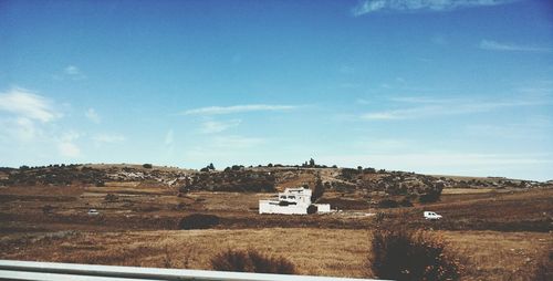 View of landscape against blue sky