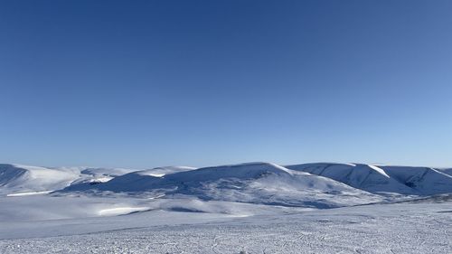 Scenic view of snowcapped mountains against clear blue sky - svalbard 