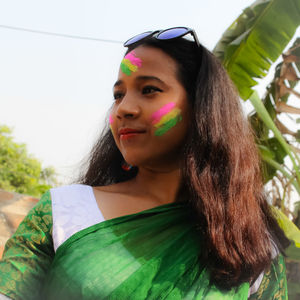 Portrait of beautiful young woman looking away