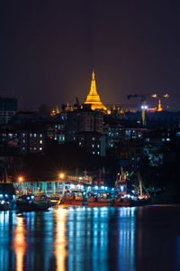 Illuminated buildings in city at night