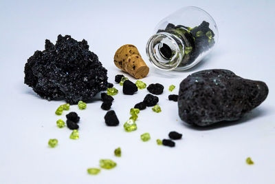 Close-up of black coffee beans on glass