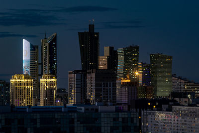 Illuminated buildings in city at night