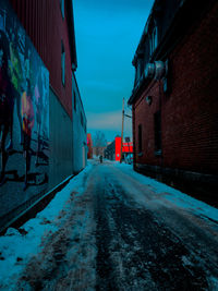 Road amidst buildings in city