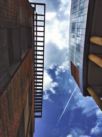 Low angle view of building against cloudy sky