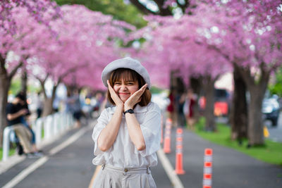 Portrait of young woman using mobile phone outdoors