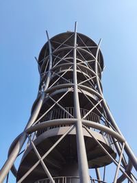 Low angle view of observation tower against clear blue sky