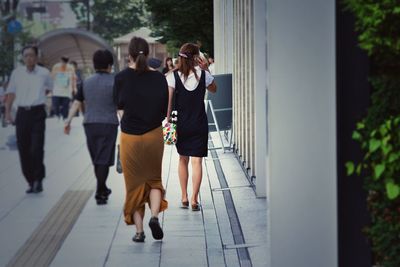 Rear view of woman photographing