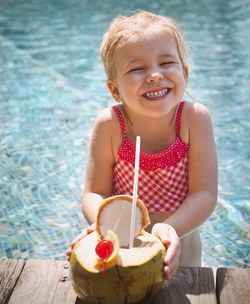 Portrait of happy girl holding ice cream