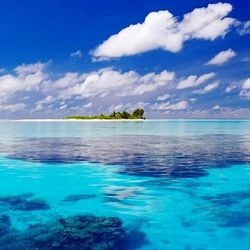 Scenic view of sea against cloudy sky