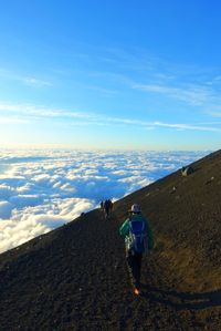 Rear view of man standing on mountain