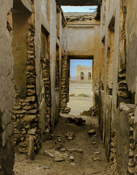 Old alley amidst buildings