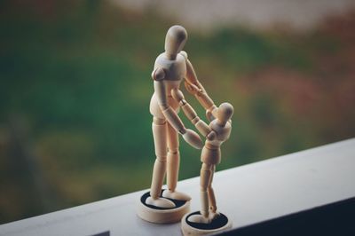 Close-up of figurine sculpture on table